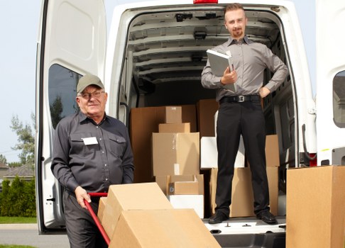 Man and van moving furniture in Dartmouthpark residential street