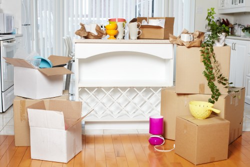 Movers handling furniture in a period Dartmouthpark home with stairs