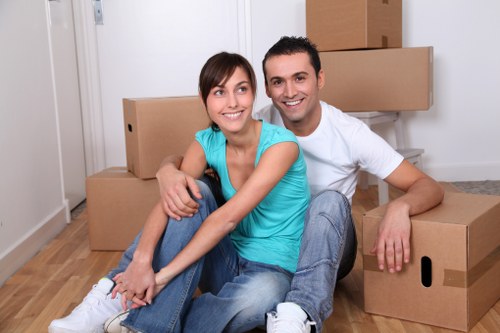 Prepared boxes and wrapped furniture ready for a house move in Dartmouthpark