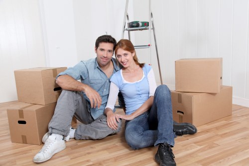 Loading boxes and household items into a moving van in Dartmouthpark