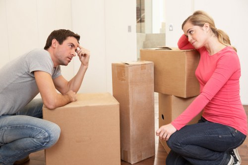 Packed household boxes and wrapped furniture ready for moving day