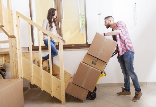 Removal team loading boxes and furniture for a Dartmouthpark home move