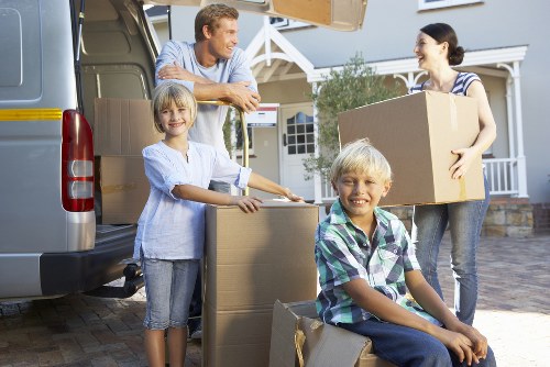Furniture and boxes being handled during a local removal service