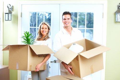 Furniture and boxed items being loaded into a van for transport